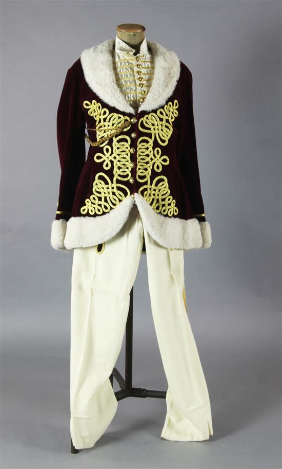 Fledermaus: Prince Orlofskys maroon velvet jacket, trimmed with gold braid and white fur trim, a matching silver and gold waistcoat an